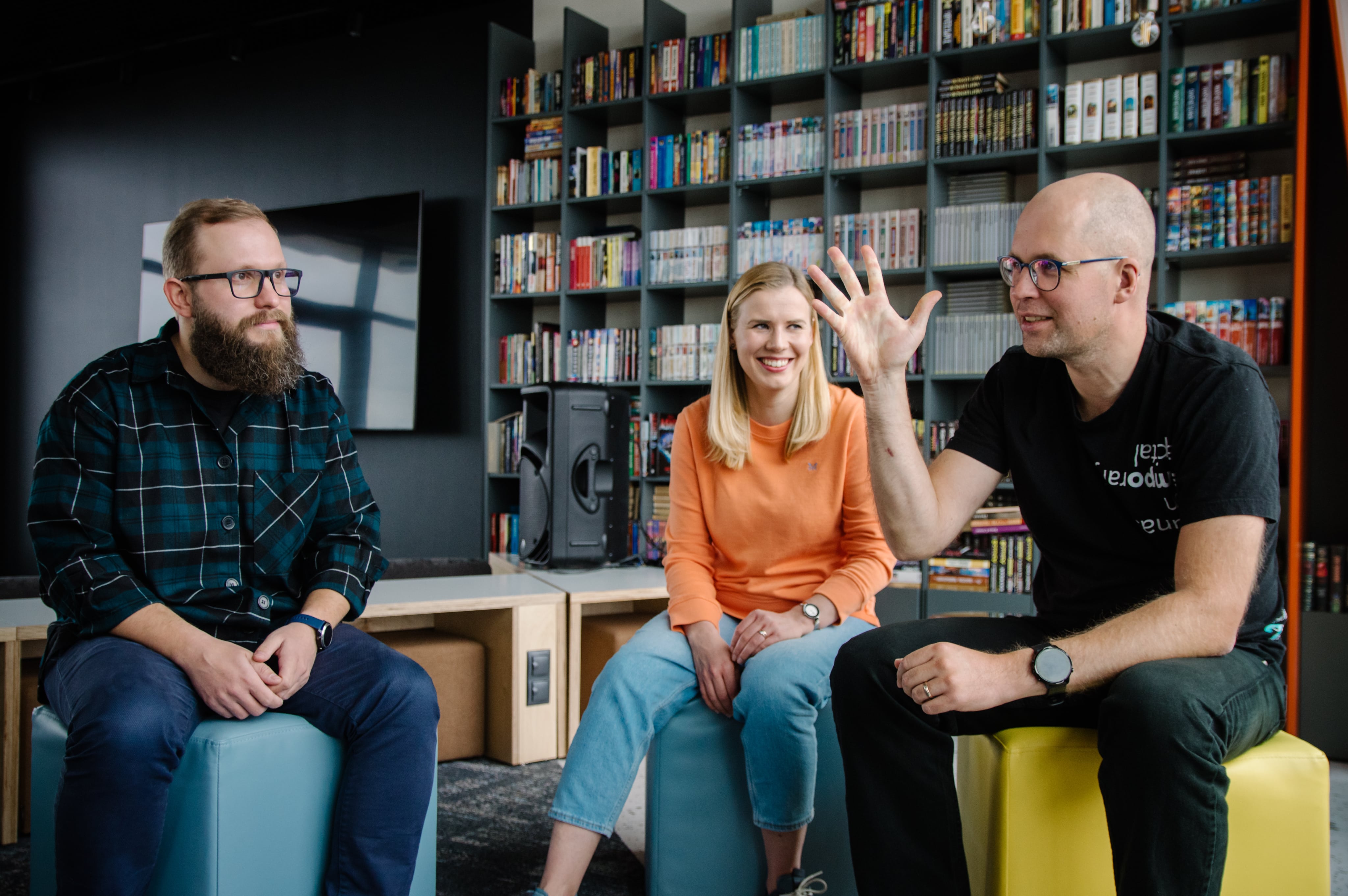 LupaSearch teammates having an informal discussion in the office lounge